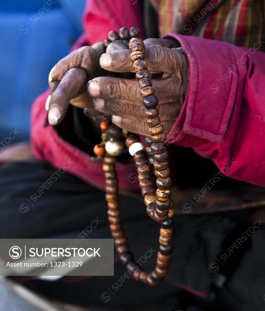 Man with prayer beads in his hand, Paro, Bhutan