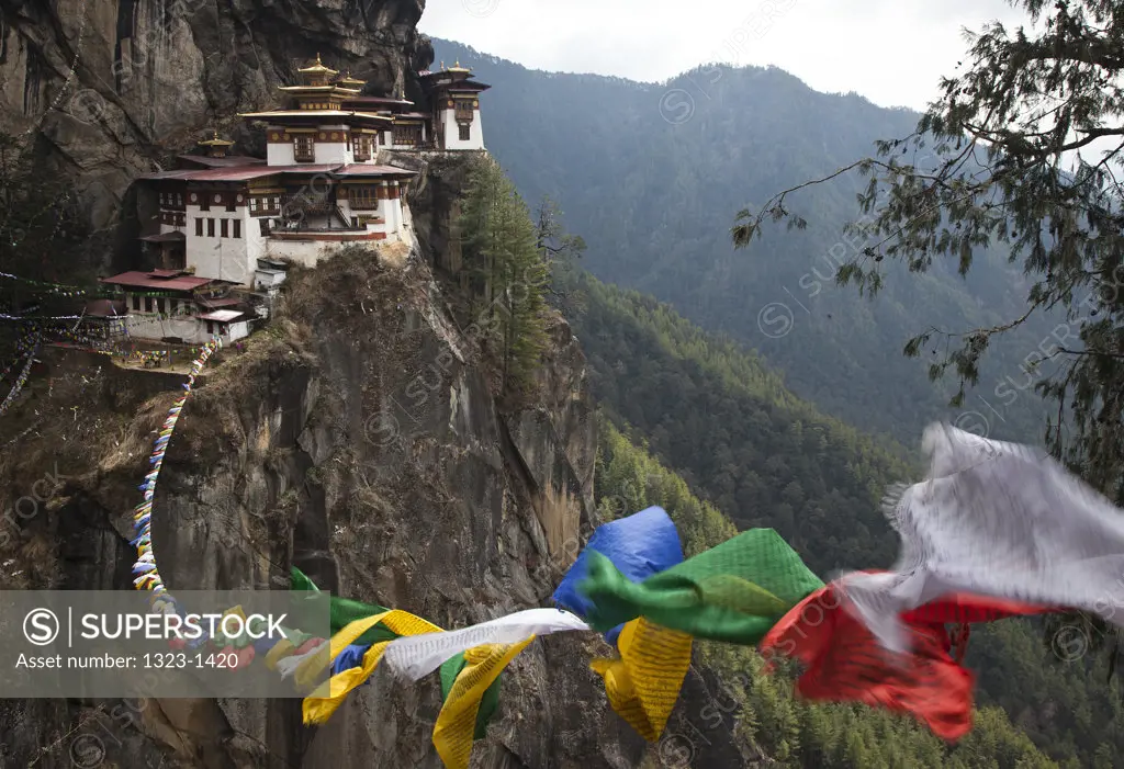 Monastery with prayer flags on a mountain, Taktsang Monastery, Paro Valley, Paro District, Bhutan