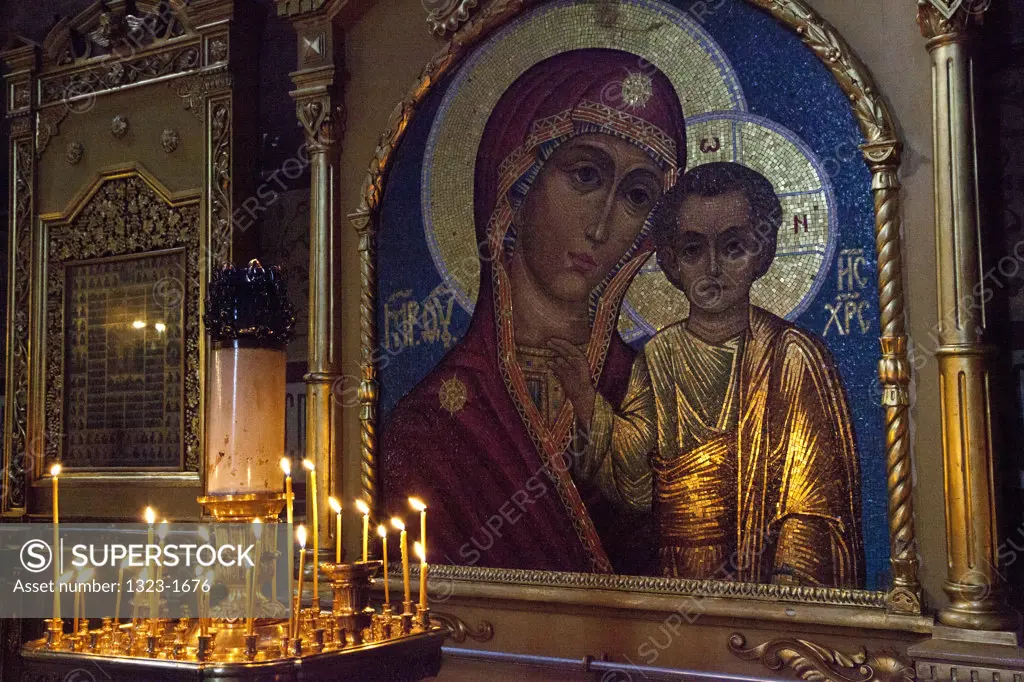 Burning candles in front of a painting in the Assumption Cathedral, St. Sergius Monastery, Sergiyev Posad, Moscow Oblast, Russia