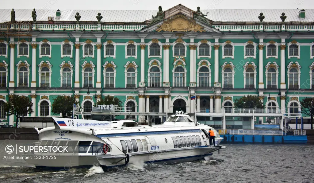 View of Winter Palace with a hydrofoil in the foreground, State Hermitage Museum, Palace Square, Neva River, St. Petersburg, Russia