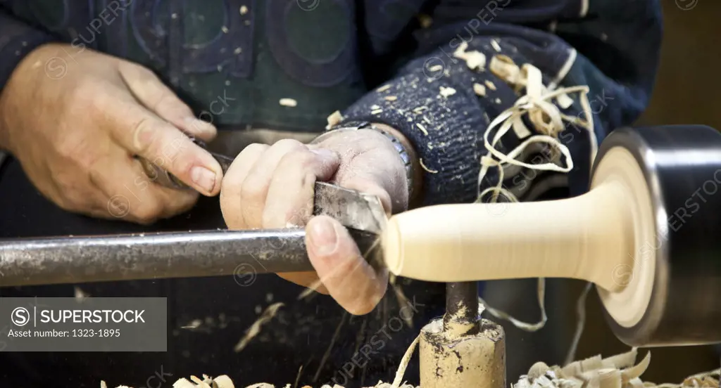 Man using a lathe to make a Matryoshka doll in Russia