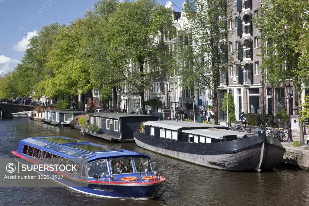 Scenic boat in the canal, Amsterdam, Netherlands