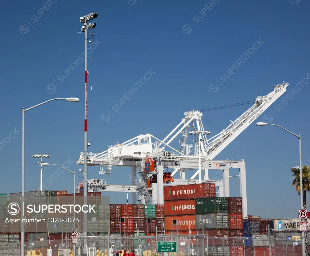 Cargo containers and cranes at a harbor, Oakland, California, USA