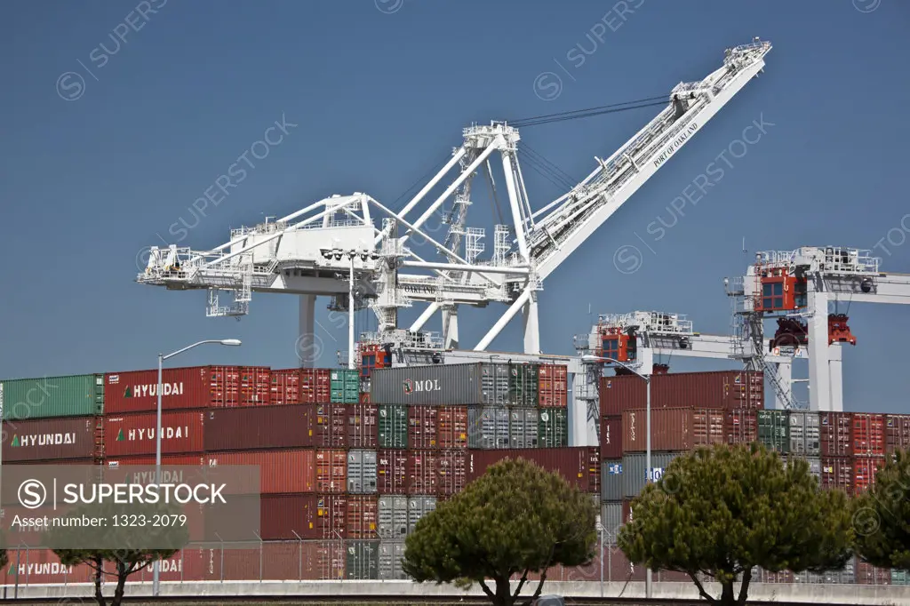 Cargo containers and cranes at a harbor, Oakland, California, USA