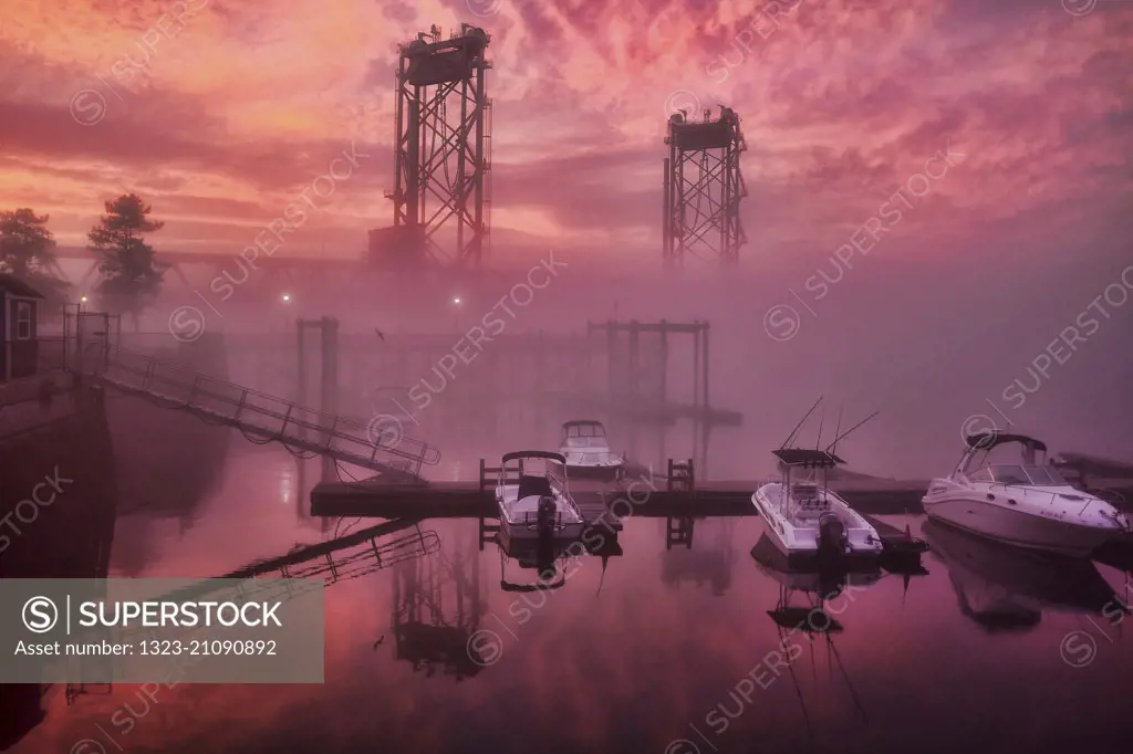 Views of Memorial Bridge in the fog and setting sun in Portsmouth, New Hampshire