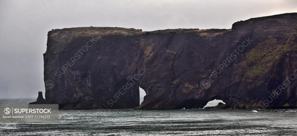 Views of Dyrholaey Beach and Rock Arch near Vik, Iceland.