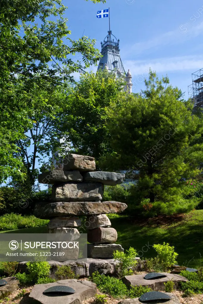 Inukshuk with the Parliament Building in the background, Quebec City, Quebec, Canada