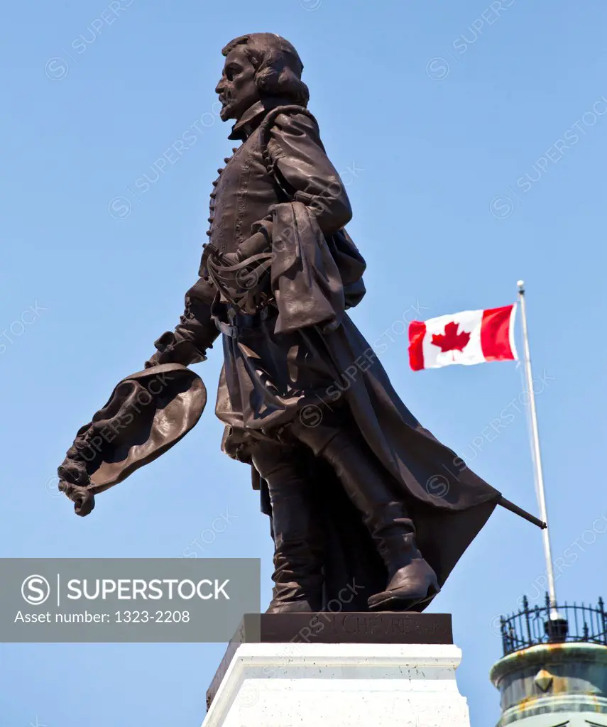 Samuel De Champlain Statue and the Canadian Flag in Quebec City, Quebec, Canada