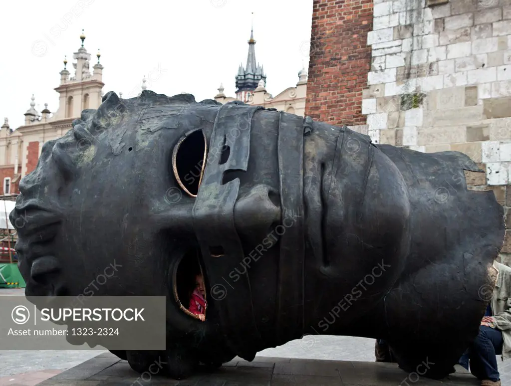 Poland, Cracow, Eros Bendato Sculpture in Main Market Square by sculptor Igo Mitoraj