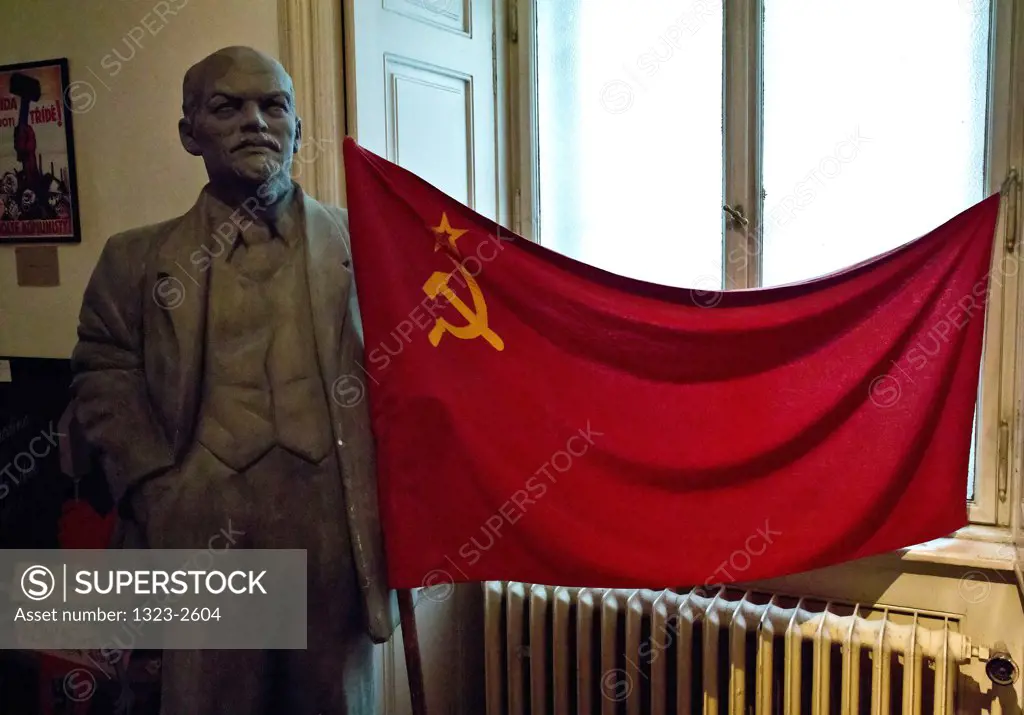 Czech Republic, Praque, Statue of Lenin and Communist Flag at Communist Museum