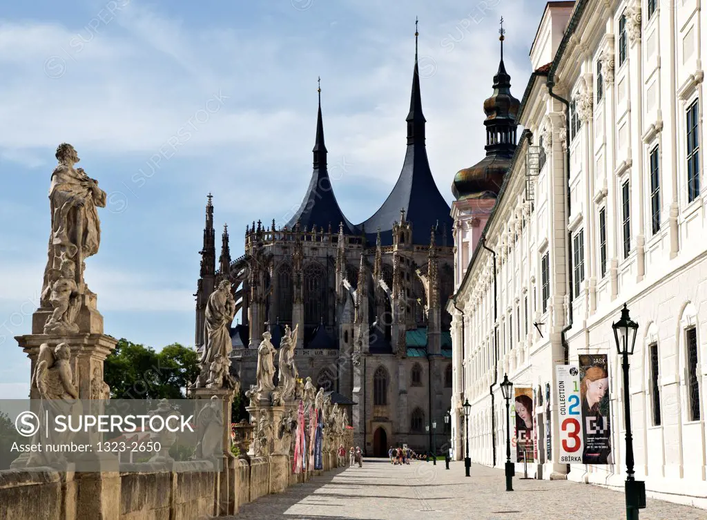 Czech Republic, Kutna Hora, Baroque Statues and St. Barbara's Cathedral in background