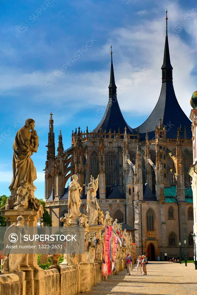 Czech Republic, Kutna Hora, Baroque Statues and St. Barbara's Cathedral in background
