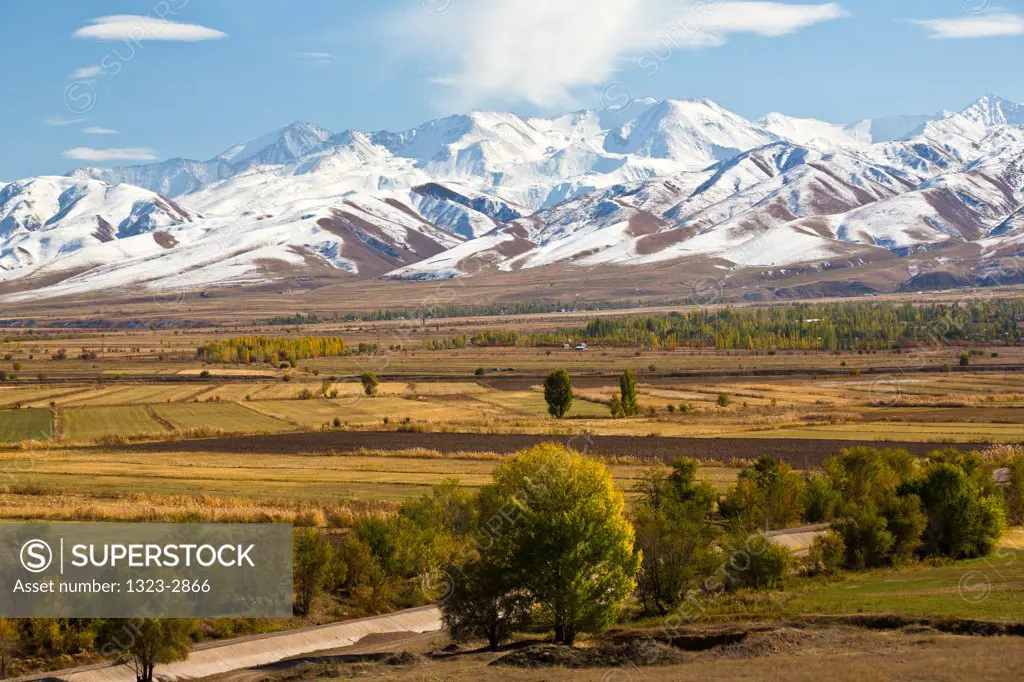 Kyrgyzstan, Truck and Tian Shan Mountains near Lake Issyk Kul