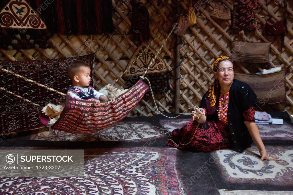 Turkmenistan, Bogurdak, Baby and mother in yurt