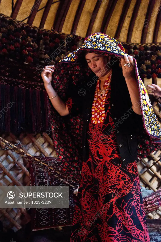 Turkmenistan, Bogurdak, Turkmen women wearing wedding garment in yurt