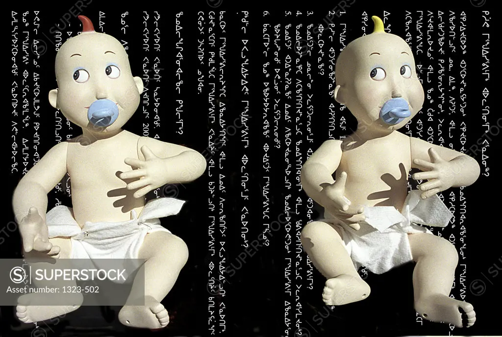 Close-up of two baby dolls in diapers