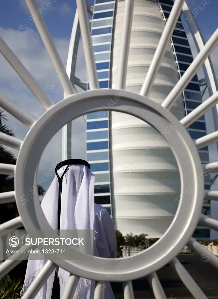 Rear view of a man in front of a hotel, Burj Al Arab Hotel, Dubai, United Arab Emirates