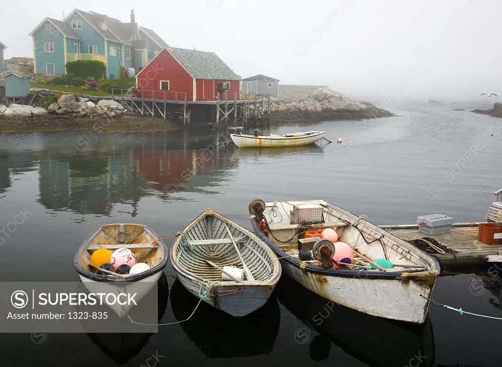 Fishing boats moored at a dock, Peggy's Cove, Nova Scotia, Canada