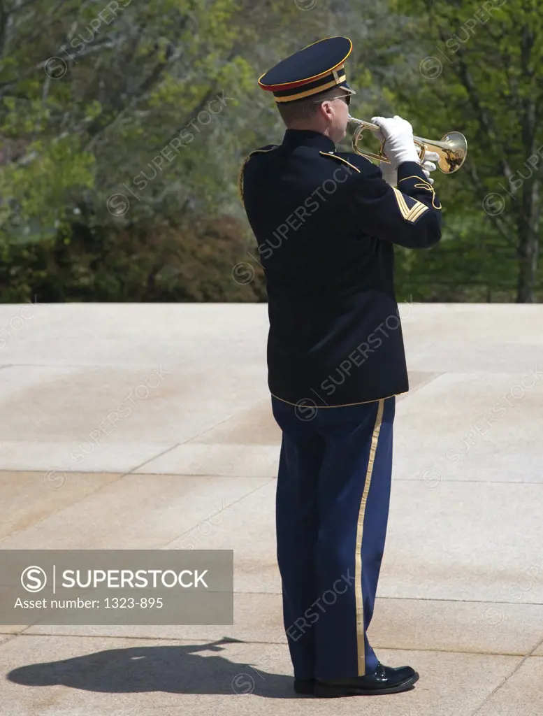 Military bugler play taps at a tomb, Tomb Of The Unknown Soldier, Arlington National Cemetery, Arlington, Virginia, USA