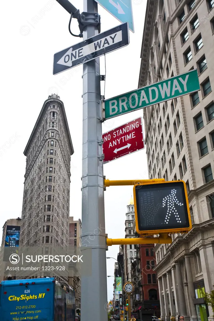 Road signs with office buildings in the city, Flatiron Building, Manhattan, New York City, New York State, USA