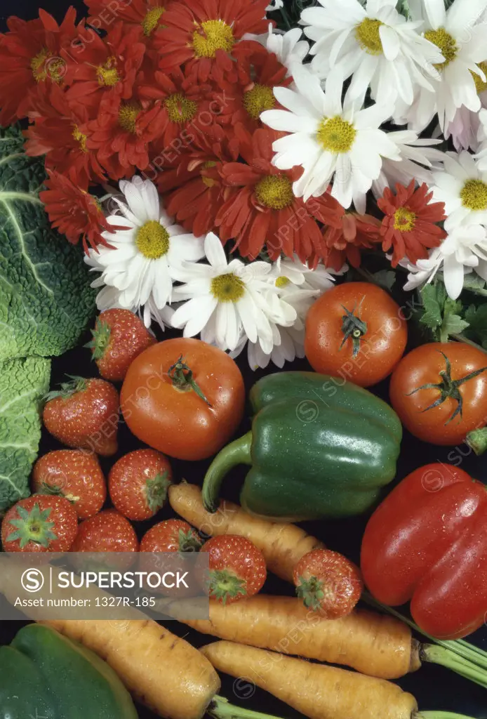 Close-up of fresh flowers with fruits and vegetables