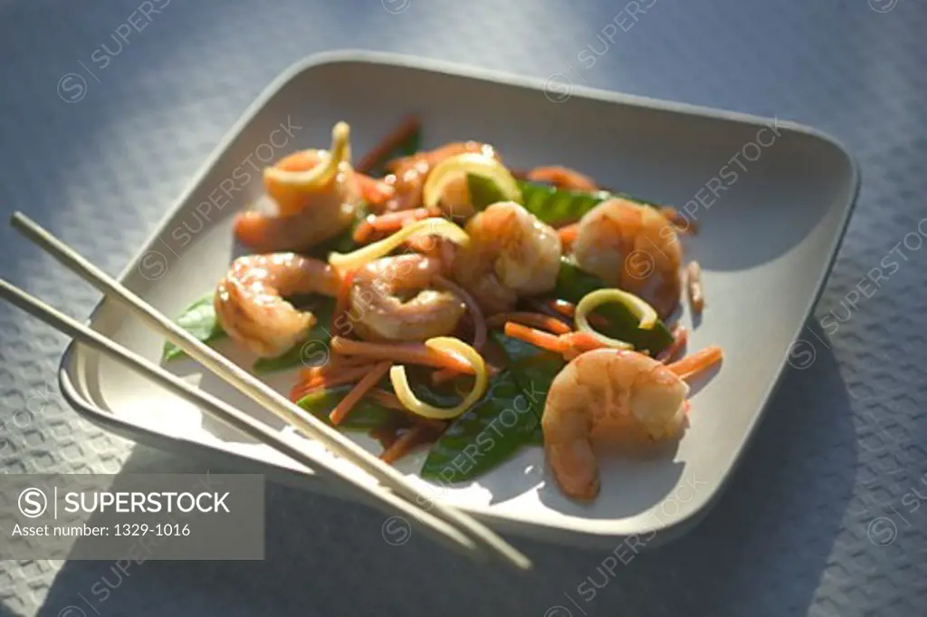 Shrimp dish with carrots in a plate