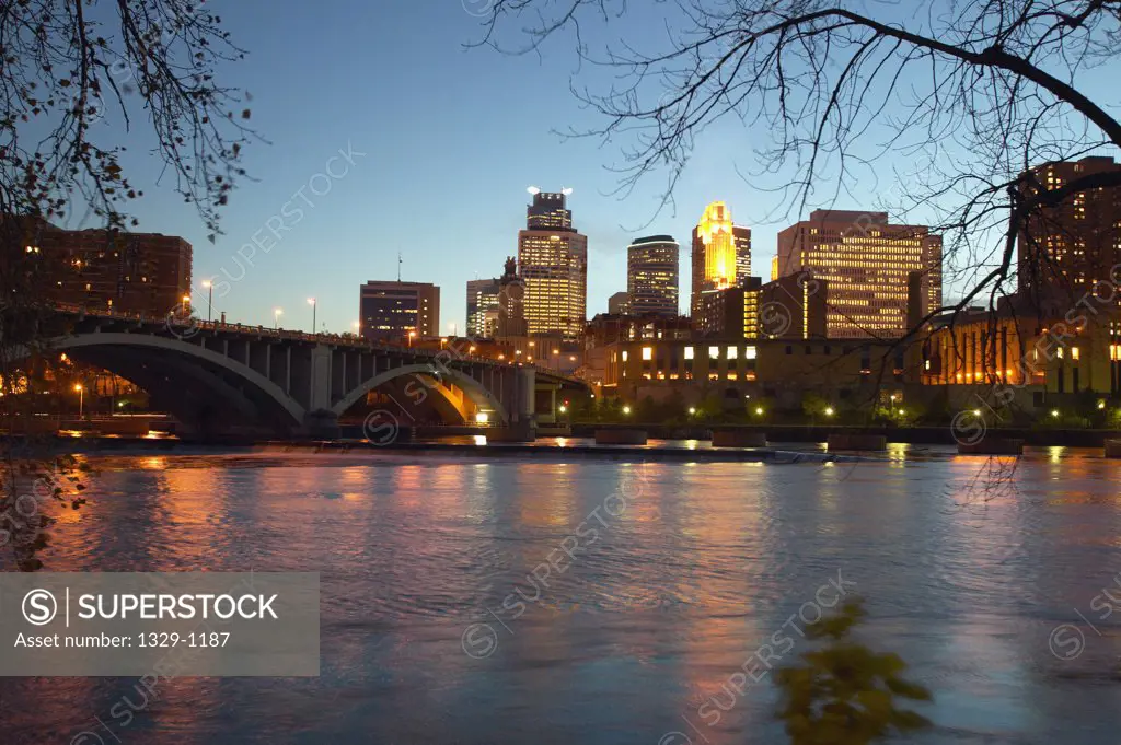 Bridge and city skyline at dusk, Minneapolis, Minnesota, USA