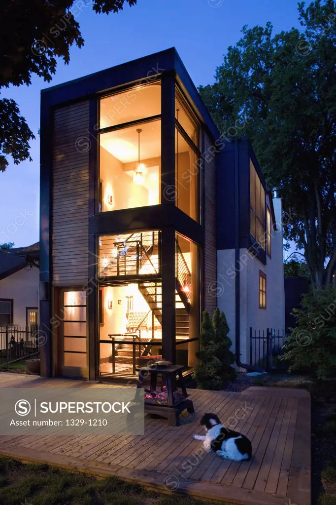 Modern home lit up at night
