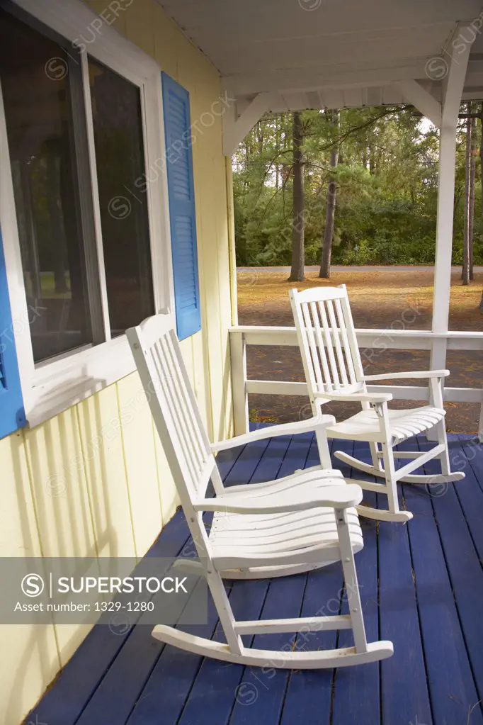 Rocking chairs on porch in the woods