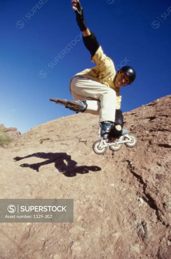 Low angle view of a young man performing a stunt