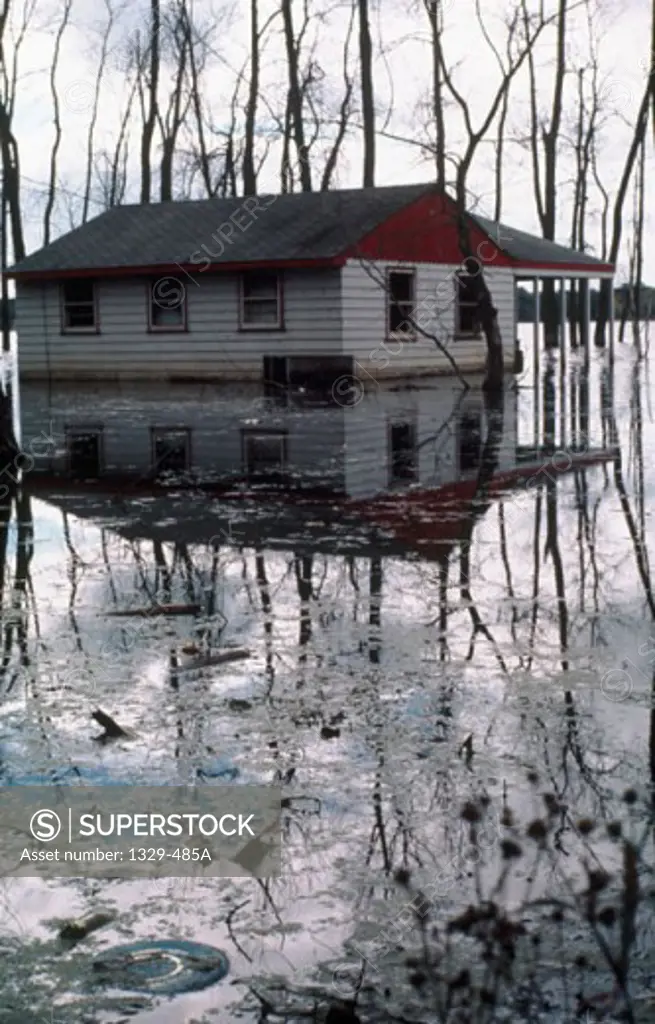 Reflection of a house in flood water