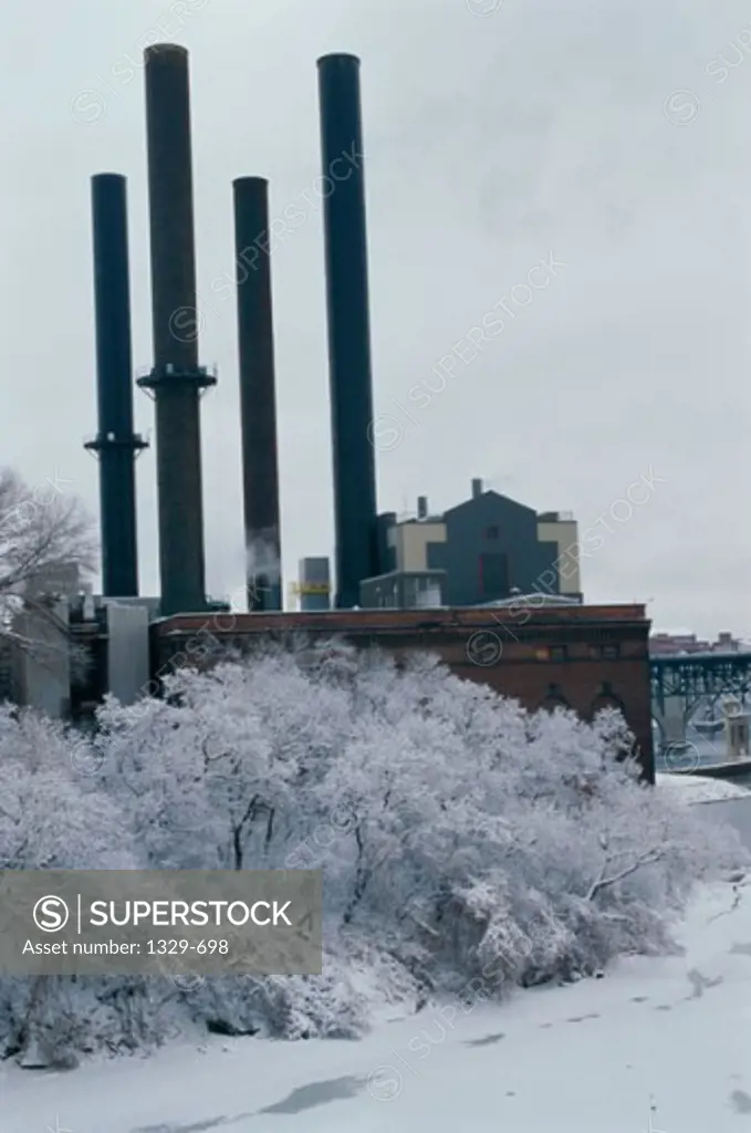 Low angle view of smoke stacks at a factory, Minneapolis, Minnesota, USA