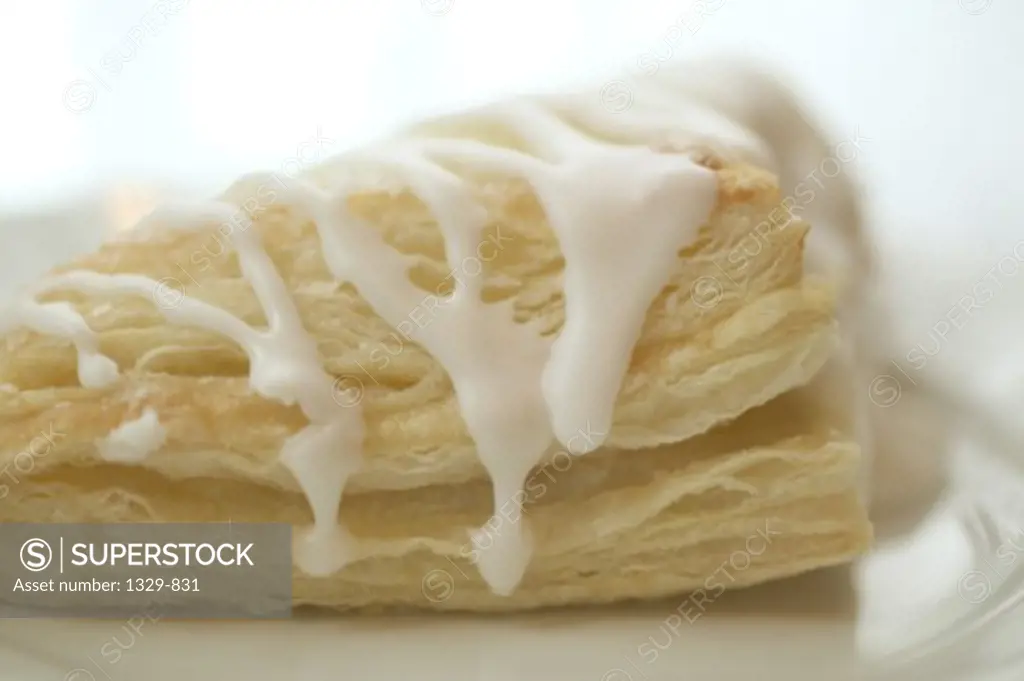 Close-up of a pastry with cream on the top