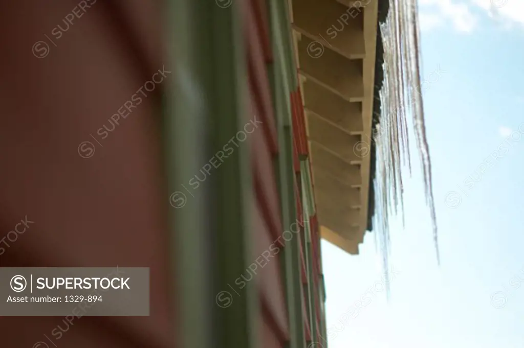 Low angle view of icicles hanging on eaves