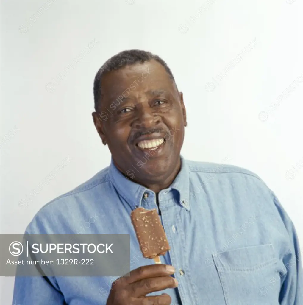 Portrait of a mid adult man holding an ice cream