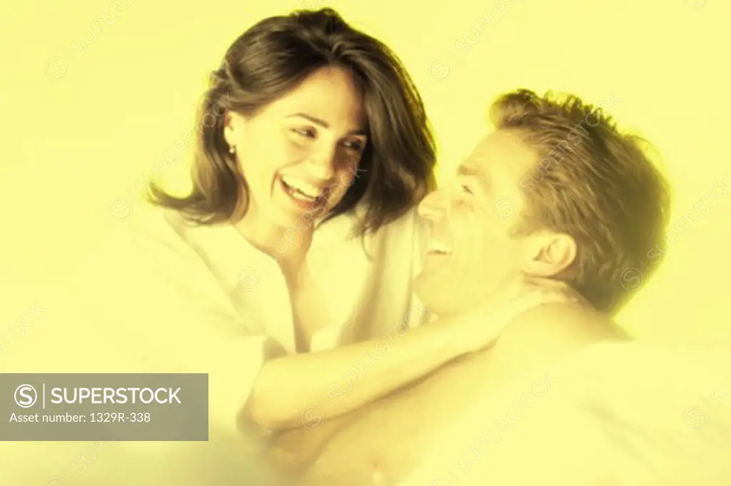 Young couple holding each other smiling