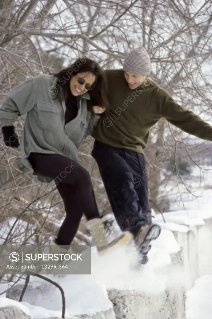 Young couple playing in the snow