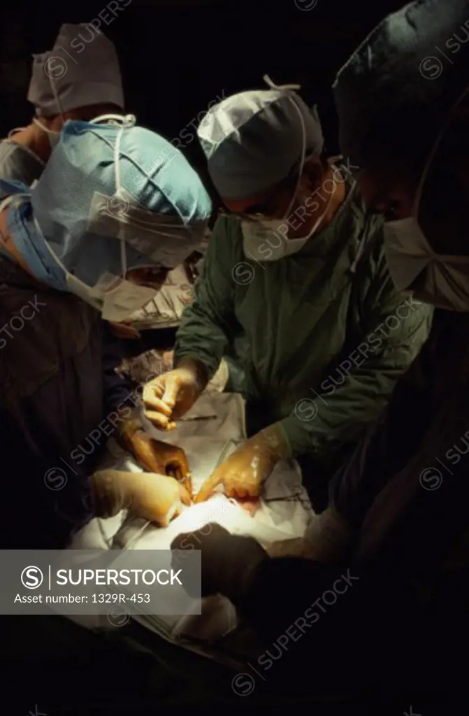 Surgeons operating in an operating room