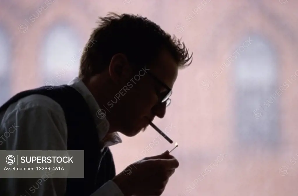 Young man smoking a cigarette
