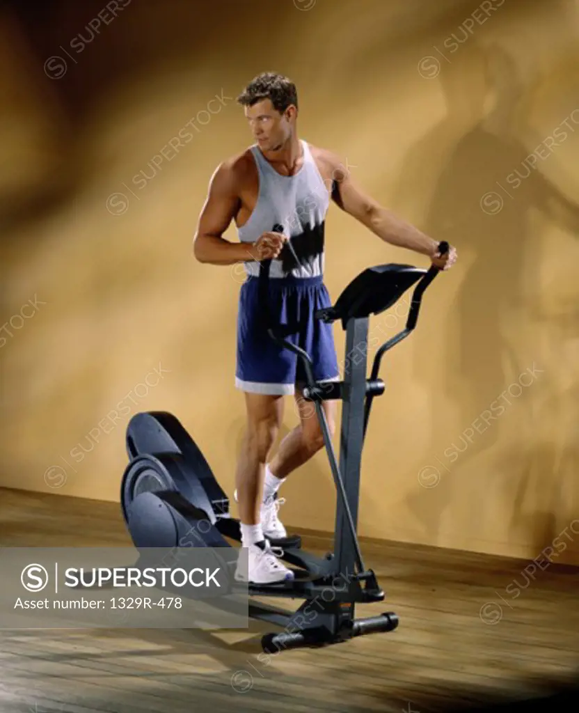 Young man exercising on an exercise machine
