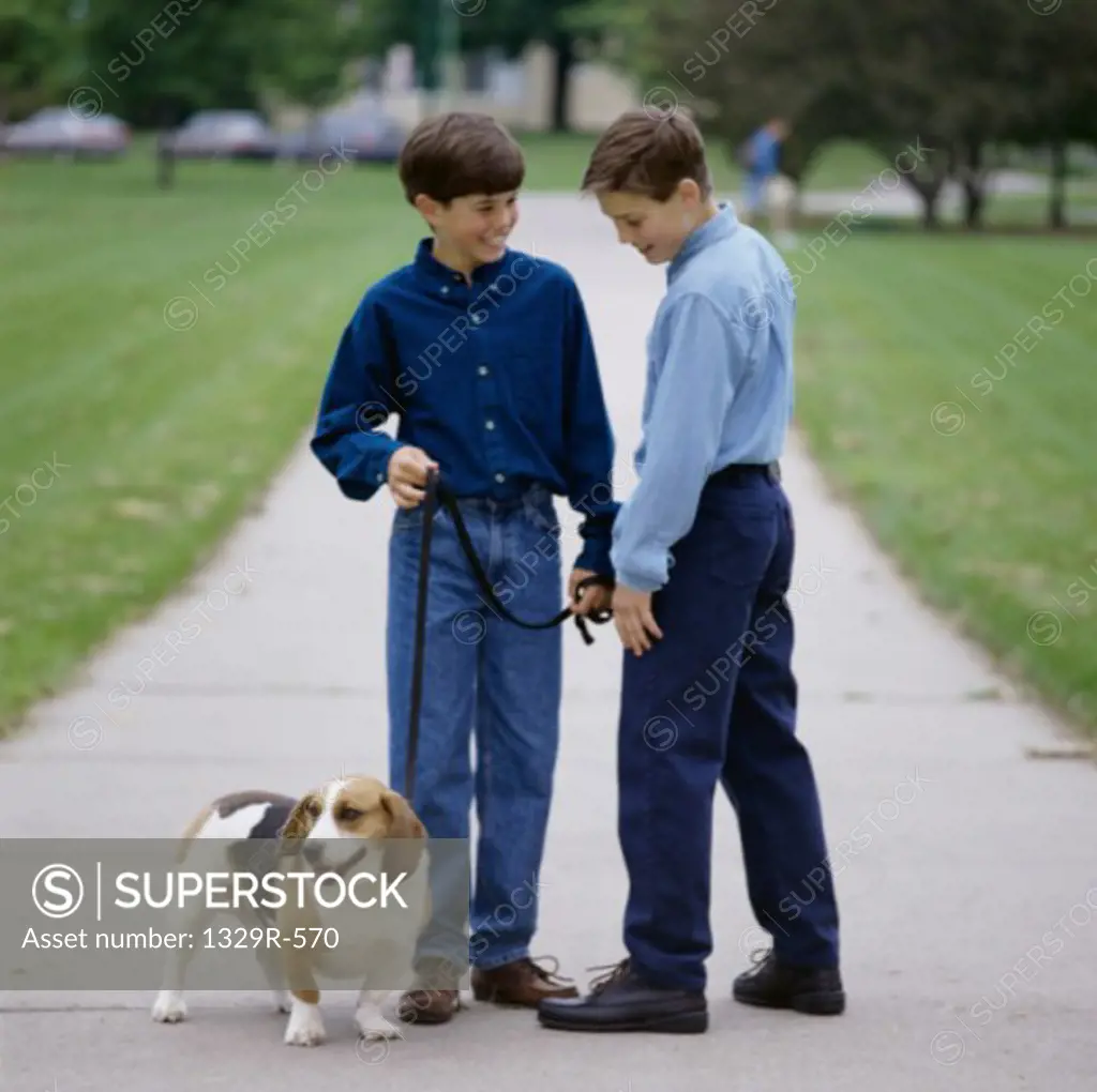 Two boys with a dog