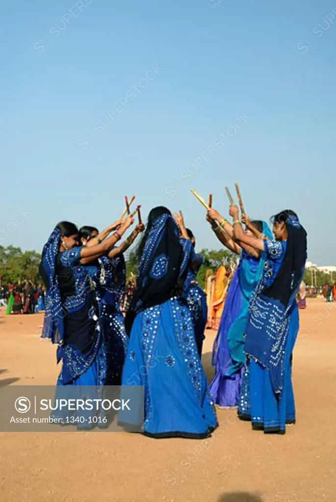 Women performing traditional Dandiya dance, India