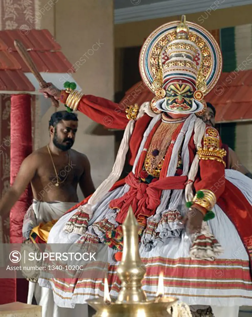 Kathakali dancer performing on a stage, Kerala, India