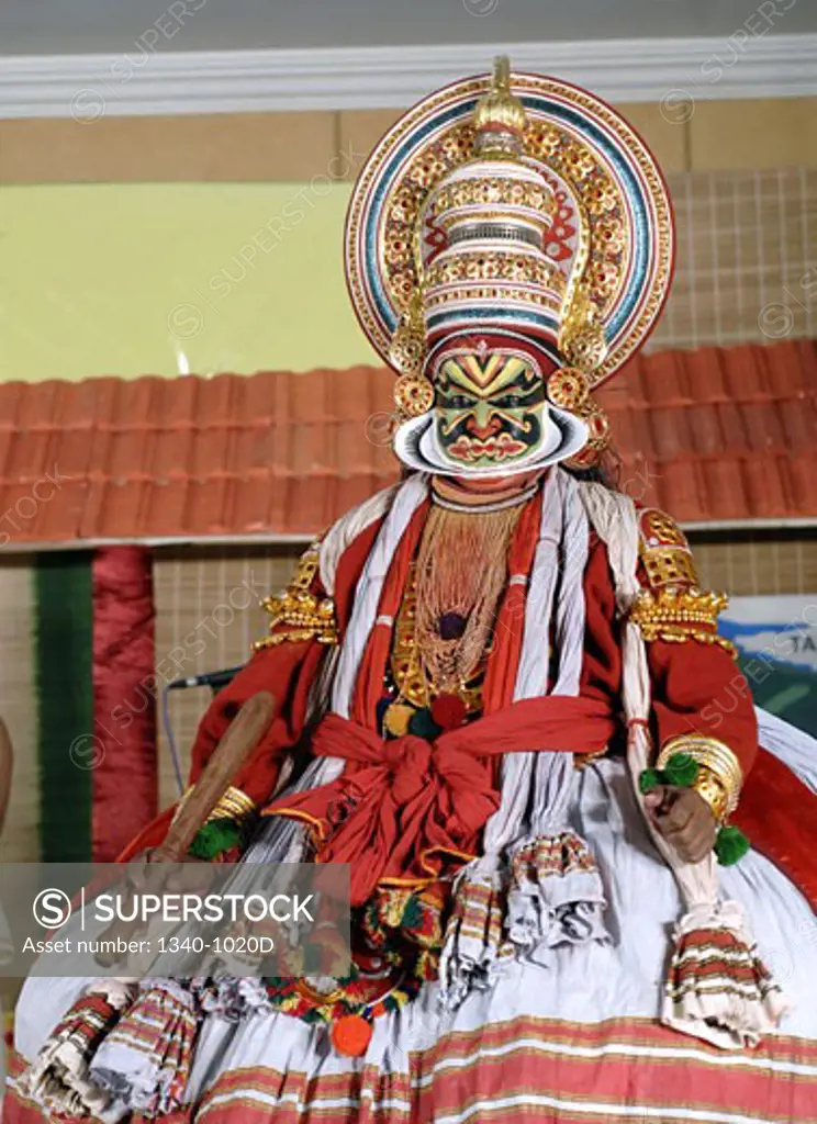 Kathakali dancer performing on a stage, Kerala, India