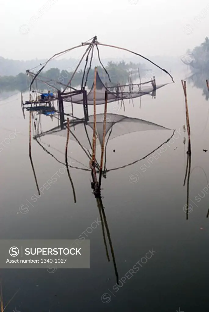 Chinese fishing net in a lagoon, Kerala Backwaters, Cherai, Ernakulam District, Kerala, India