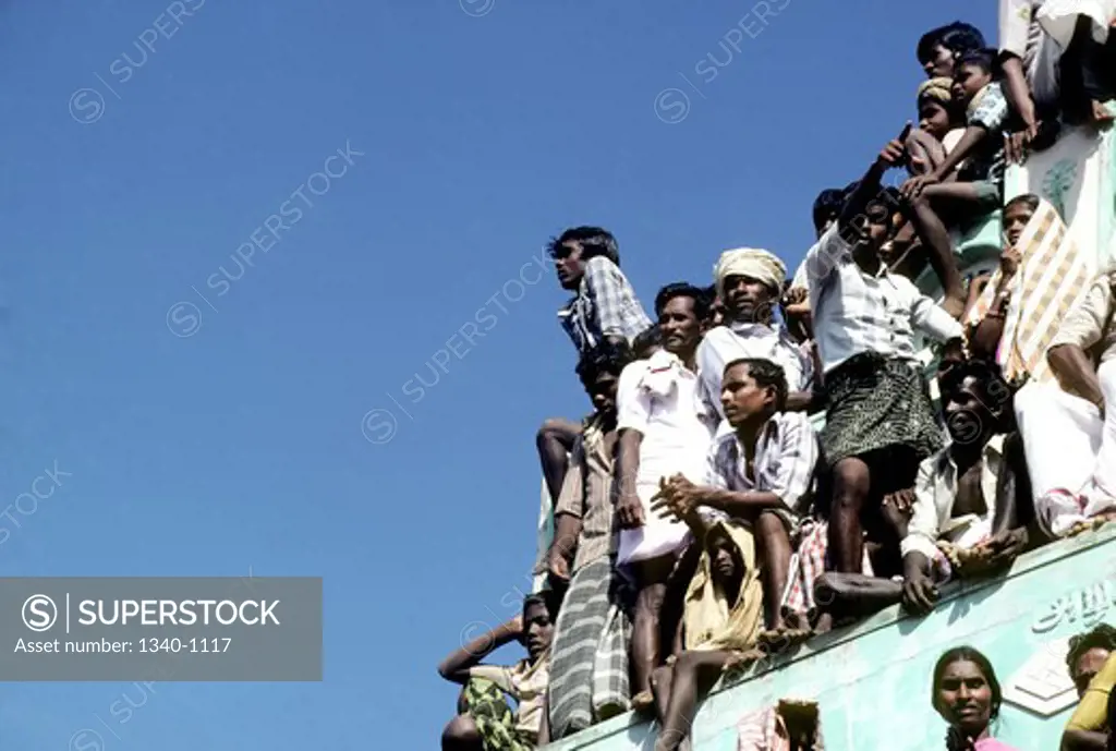 India, Tamil Nadu State, Madurai, Spectators watching Jallikattu at Alanganallur, South India, Jallikattu is a bull taming sport played as a part of Pongal celebration, This is one of the oldest living ancient sports seen in the modern era,