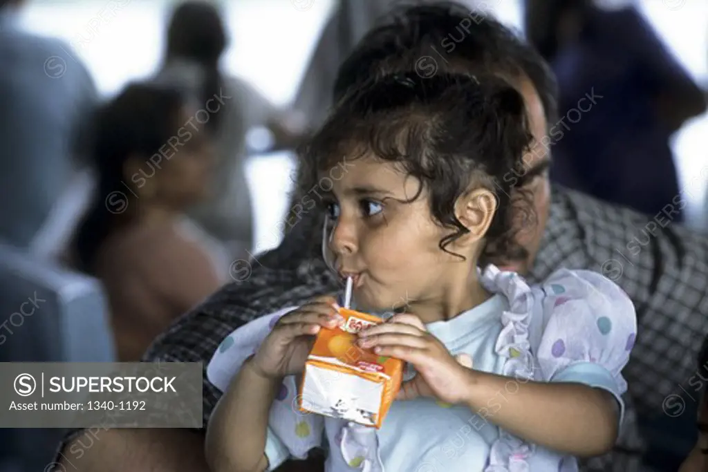 Girl drinking juice, Port Blair, Andaman and Nicobar Islands, India