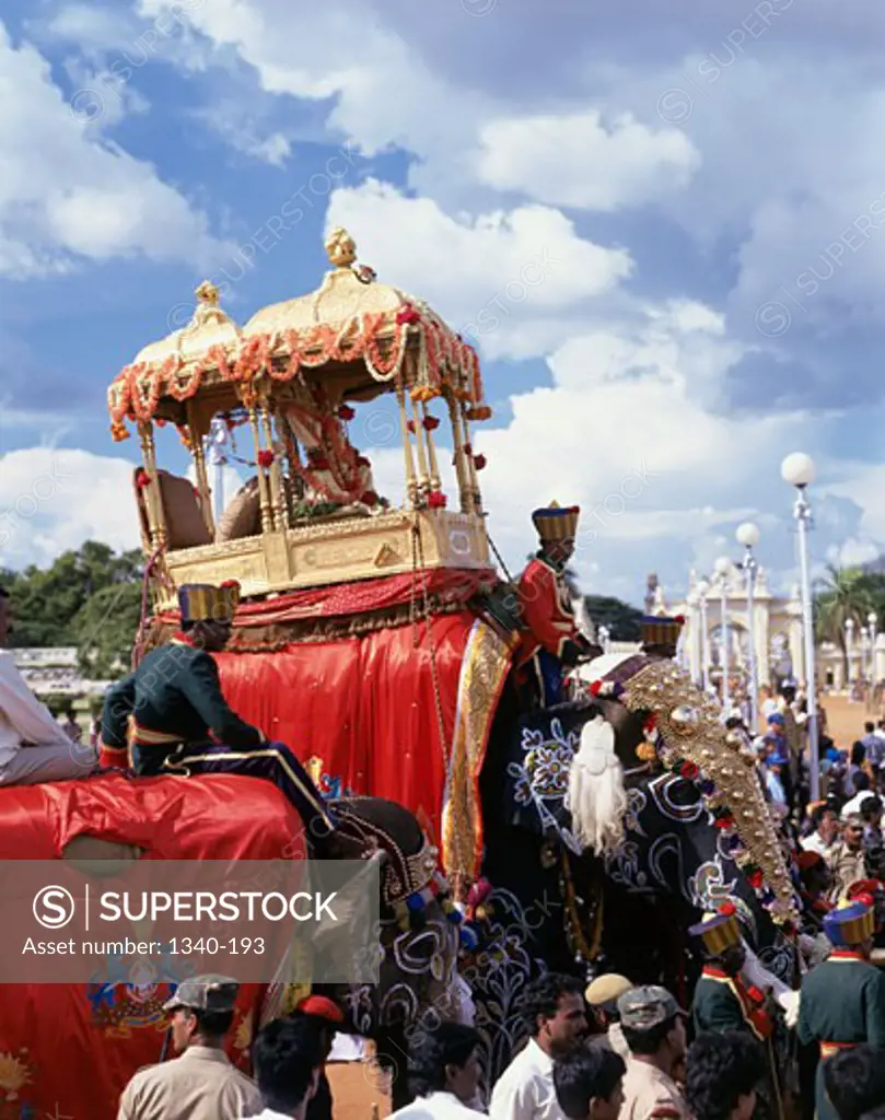 Group of people with two decorated elephants in the procession of a traditional festival, Dussehra, Mysore, Karnataka, India