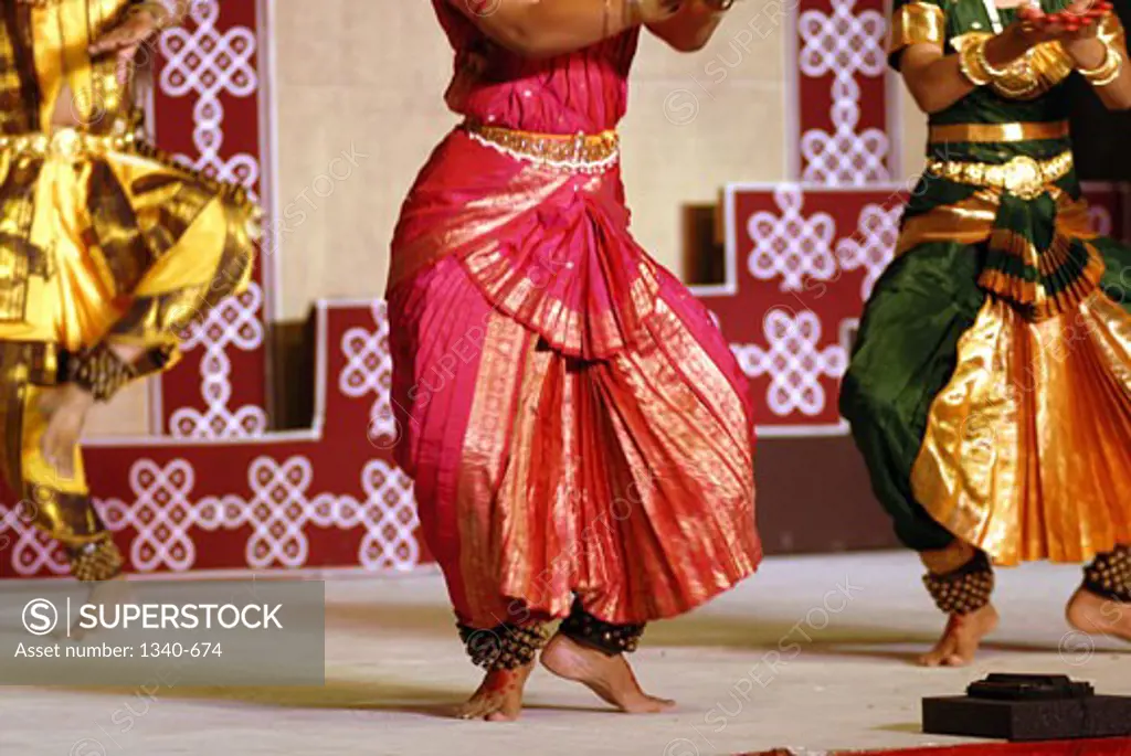 Low section view of two women performing Bharatnatyam, a classical dance of India, India