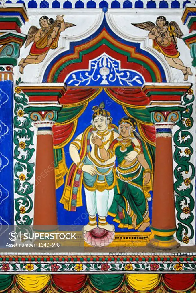 Lord Krishna with His consort Radha. 150 year old Mural (vegetable dye) and stucco work on the interior wall of the temple choultry at Pillaiyarpatti, Tamil Nadu, India., Artist Unknown